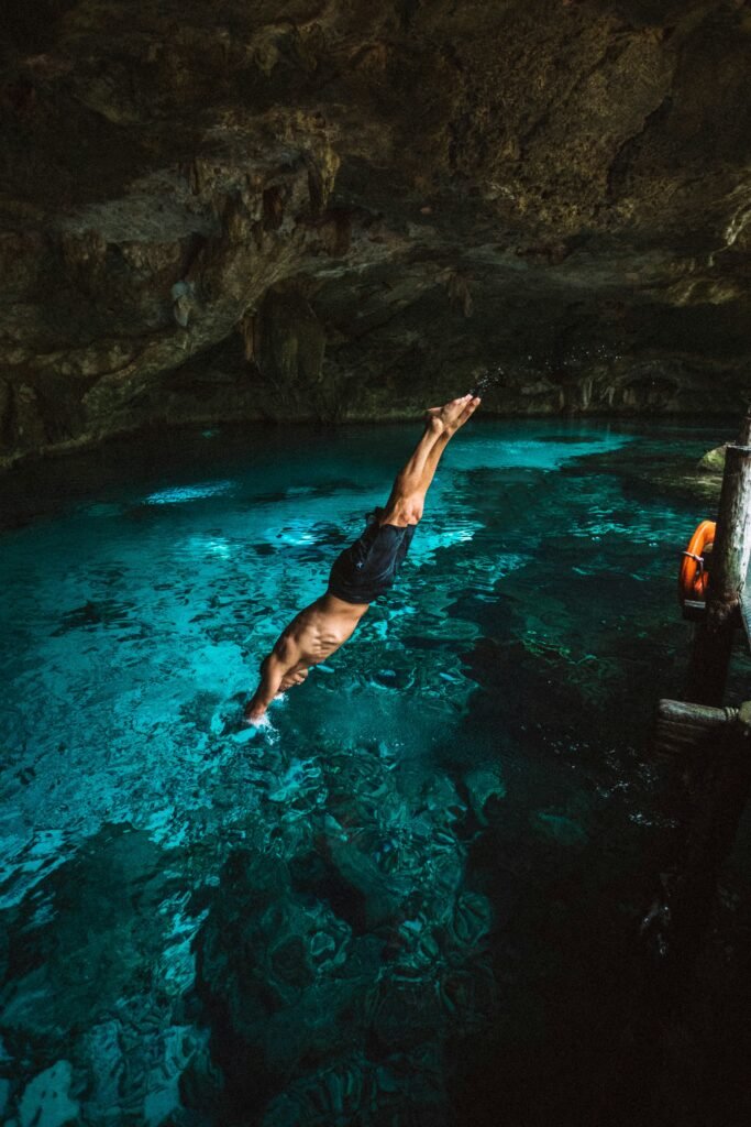 DIVING INTO A CENOTE IN TULUM MEXICO